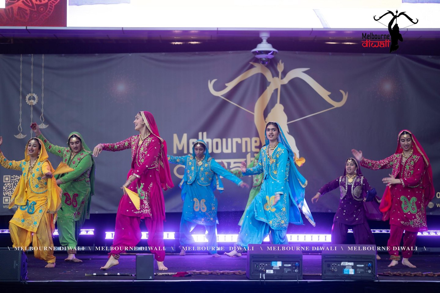 Dancers performing in colourful traditional outfits at a Diwali festival